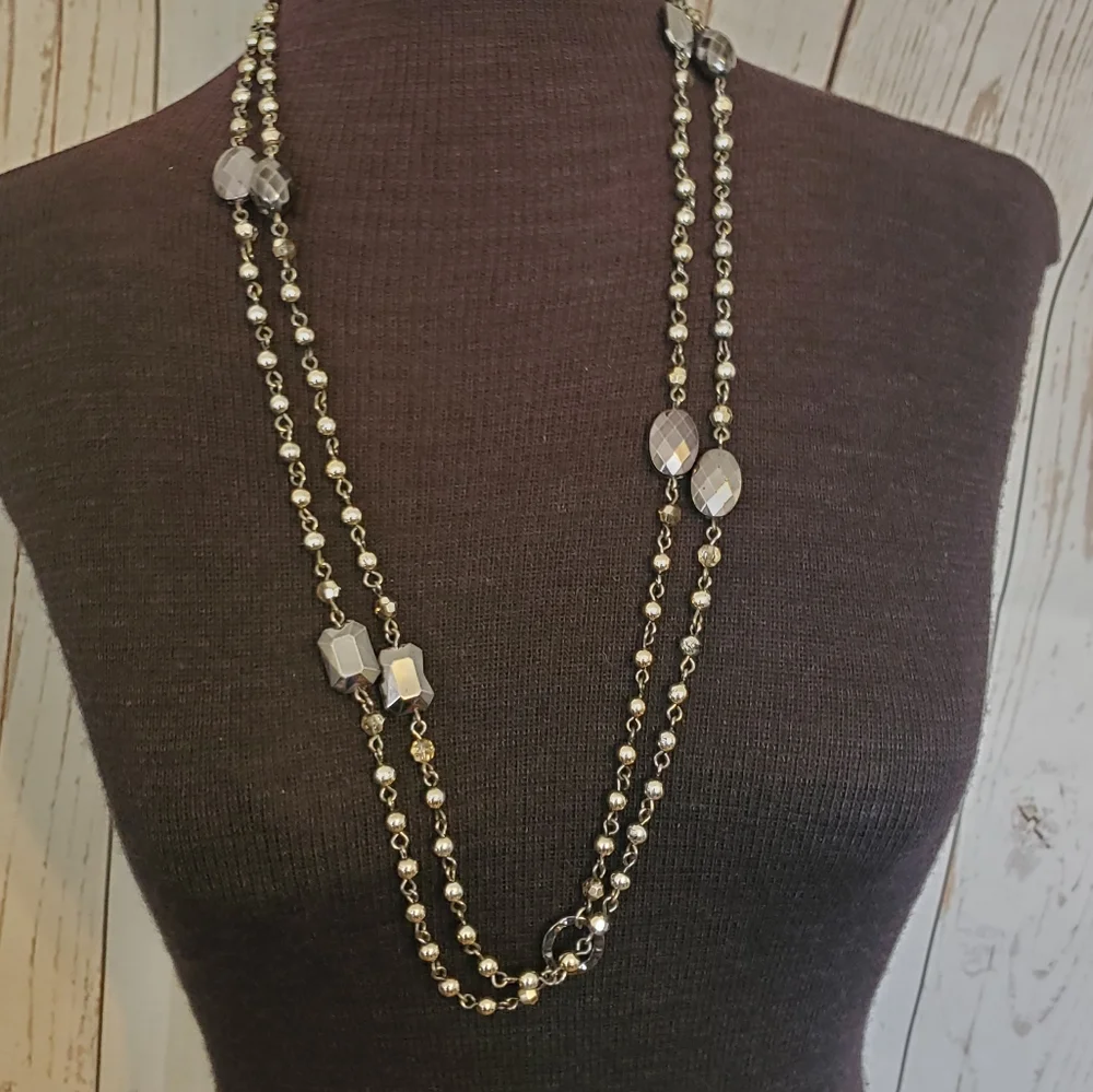 Silvertone and black bead and geometric stations necklace